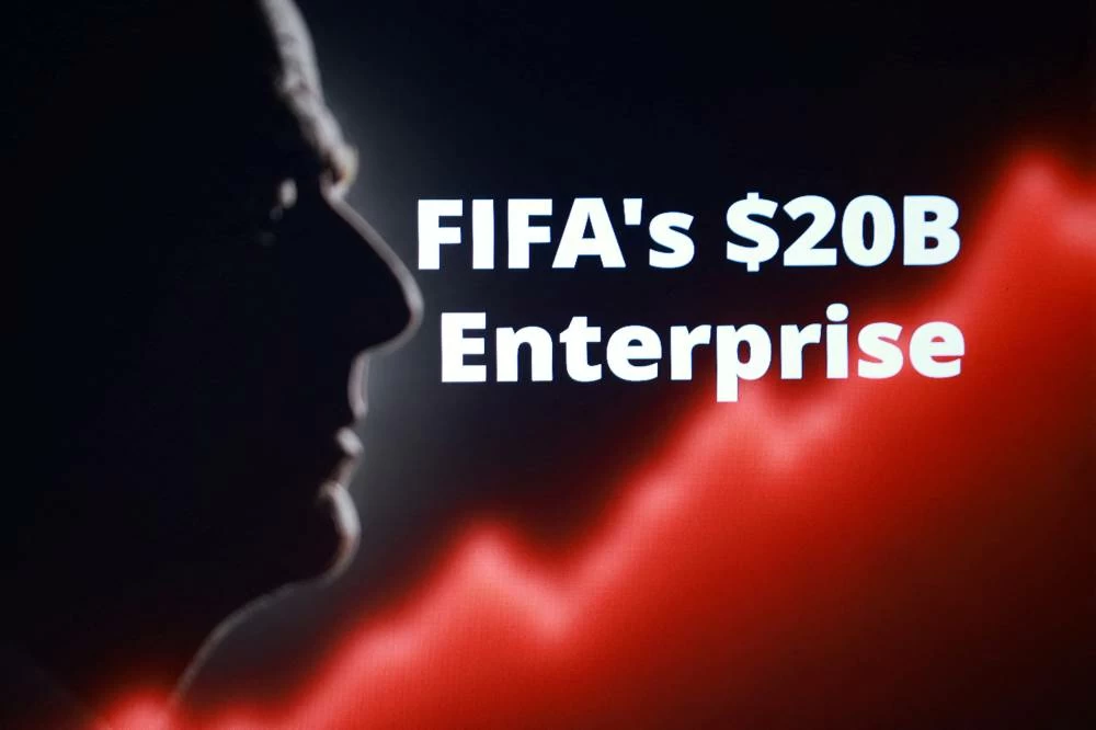 Silhouette of Gianni Infantino, FIFA President, words "FIFA's $20B Enterprise" and rising stock graph are seen in this illustration taken, July 28, 2026.(reuters)