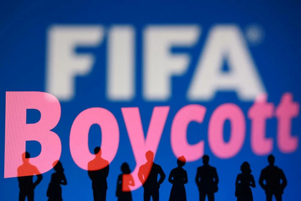 A FIFA logo, silhouettes of people and the word "Boycott" are seen in this illustration taken July 30, 2026. Picture credit: Reuters
