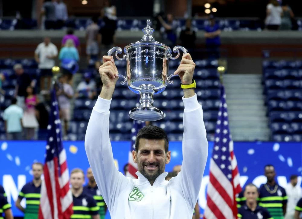 Serbia's Novak Djokovic celebrates with the trophy after winning the U.S. Open in 2023. (Reuters)