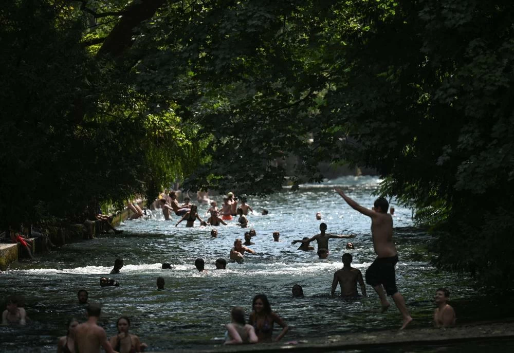People enjoy the cool waters of the Isar during a heatwave in Munich, Germany, July 31, 2026. Picture credit: Reuters