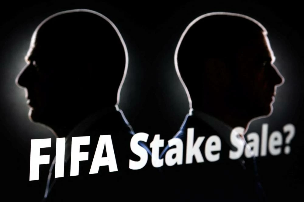 Silhouettes depicting FIFA President Gianni Infantino and UEFA President Aleksander Ceferin are seen next to text that reads "FIFA Stake Sale?" in this illustration taken July 30, 2026. Picture credit: Reuters