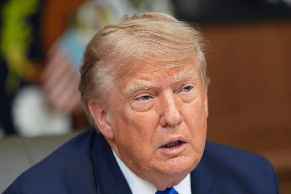 File picture President Donald Trump speaks during a cabinet meeting. In a social media post on Saturday, Trump said the proposed deal would include the "immediate, complete and total" reopening of the Strait of Hormuz and an end to what he described as Iran's nuclear threat. AP