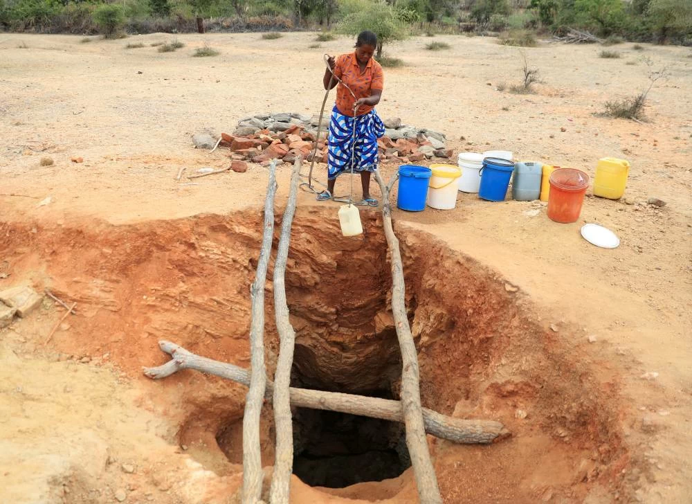 File phtoto: A woman fetches drinking water from an unprotected well, as Zimbabwe is experienced an El Nino-induced drought. (Reuters)