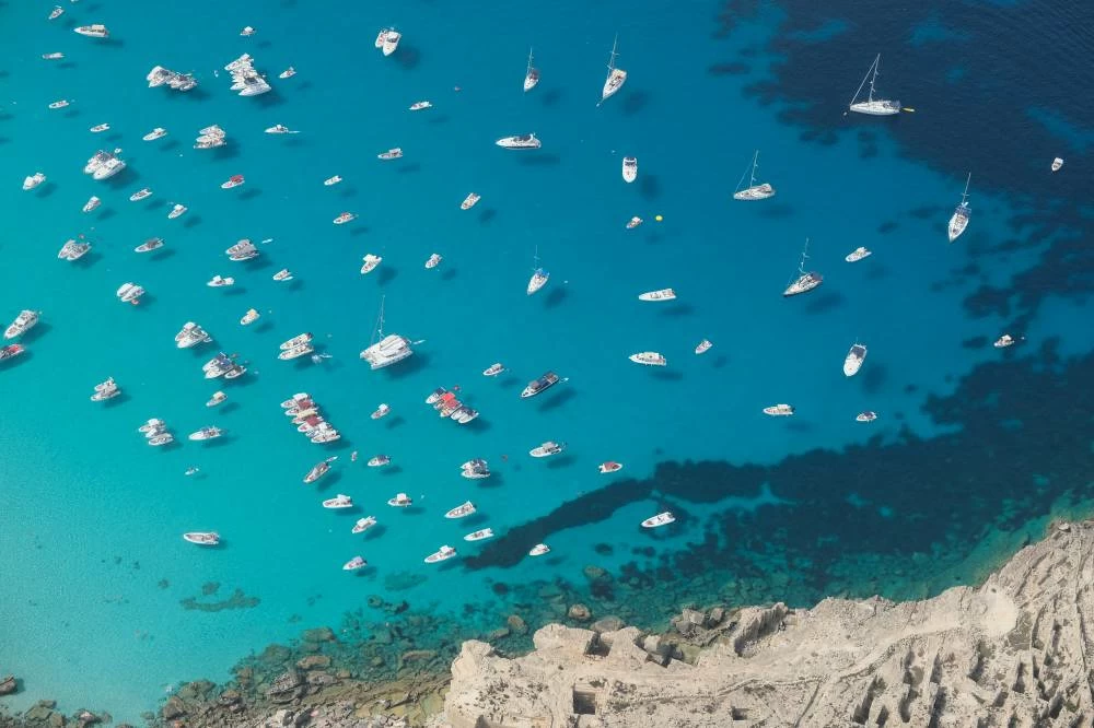 Boats gather in the waters off Favignana, Italy, September 17, 2023.(reuters)