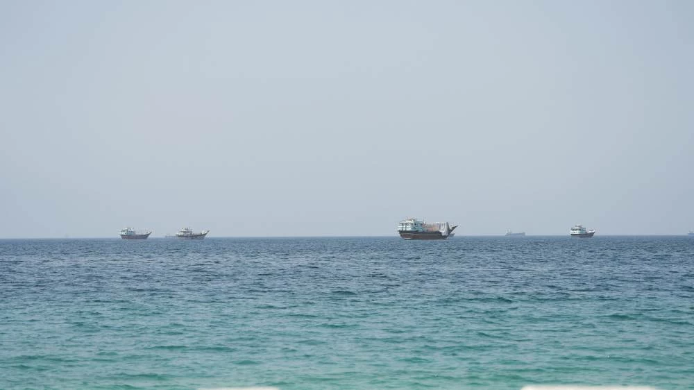 Vessels near the Strait of Hormuz, as seen from Musandam, Oman, August 6, 2026. (Reuters)
