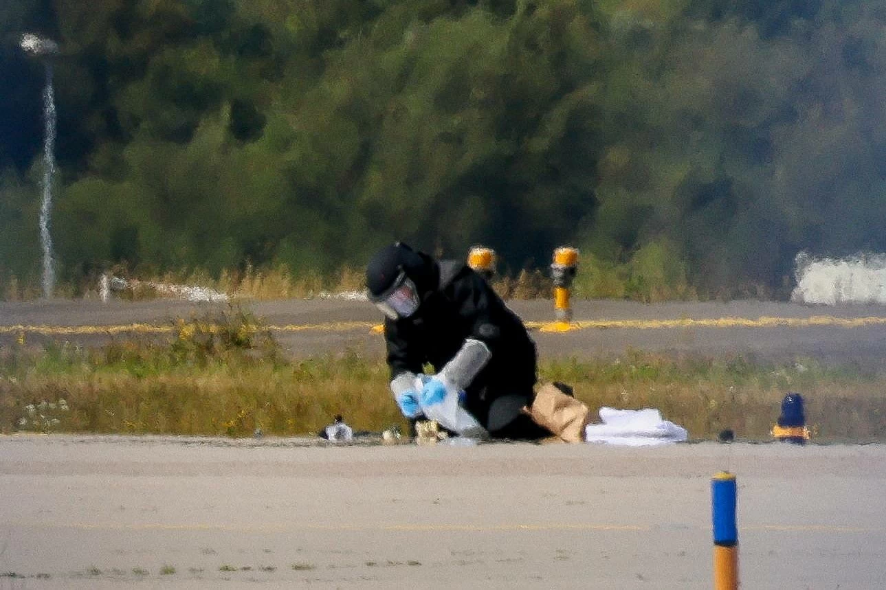 A police officer in protective clothing works at Leipzig/Halle Airport in Schkeuditz, Germany, August 5, 2026, after the police said explosives experts examined a drone near a runway. (Reuters)