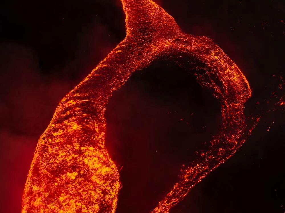 A drone view shows molten lava flowing down the slope  during an eruption at Mount Etna in Sicily, Italy, August 11, 2026.  Giuseppe Di Stefano/Etna Walk/via REUTERS