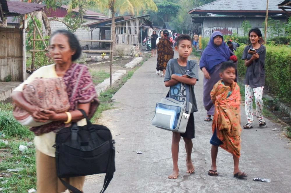 Villagers outside their homes following an earthquake of magnitude 7.7, in Talibura, East Nusa Tenggara, Indonesia, August 15, 2026. Picture taken with a mobile phone. REUTERS
