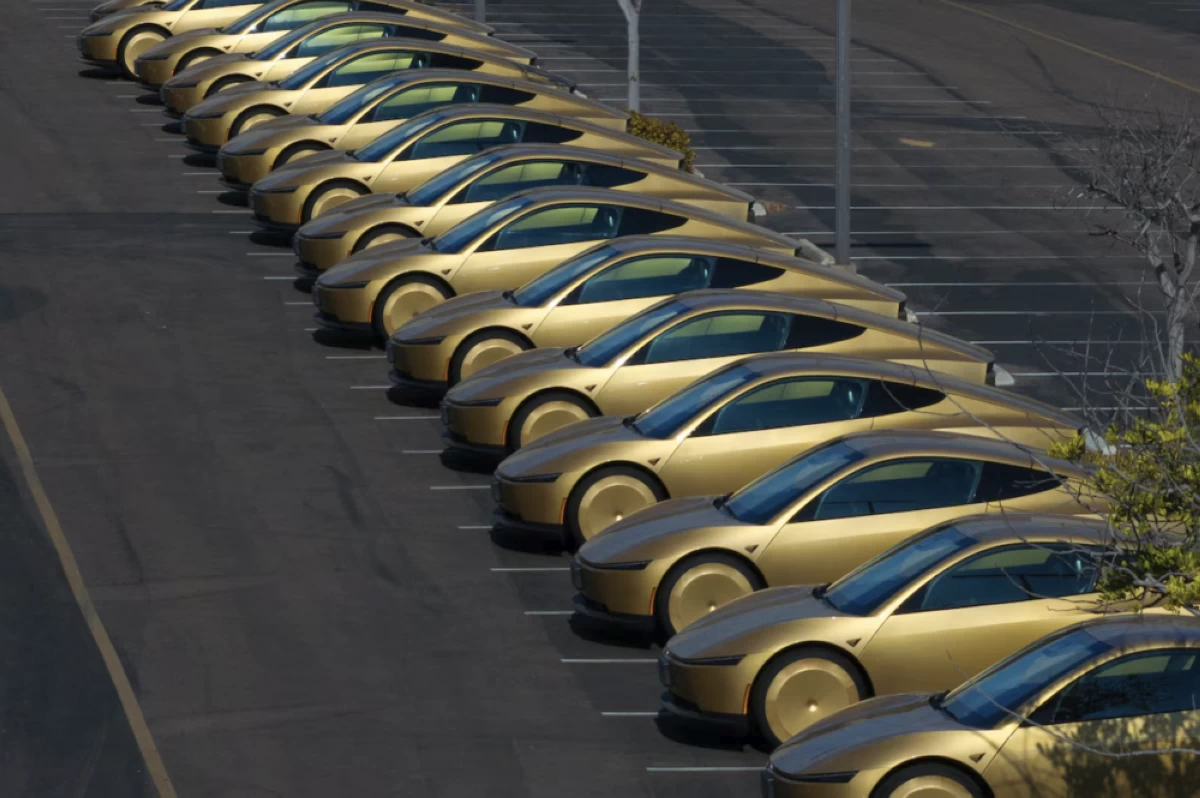 A drone view shows gold coloured Tesla Cybercabs lined-up in a parking lot in San Diego, California, U.S., August 12, 2026. Picture credit: Reuters