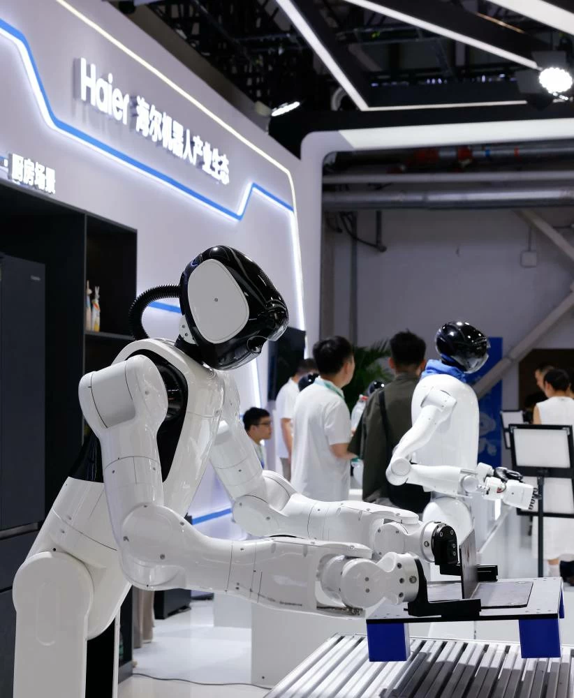 Industrial humanoid robots on display at the Haier STEP booth at the 2026 World Robot Conference, in Beijing, China, August 19, 2026. (Reuters)