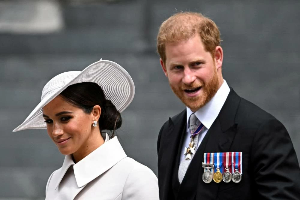 Britain's Prince Harry and his wife Meghan, Duchess of Sussex, leave after the National Service of Thanksgiving held at St Paul's Cathedral as part of celebrations marking the Platinum Jubilee of Britain's Queen Elizabeth, in London, Britain, June 3, 2022. (Reuters)