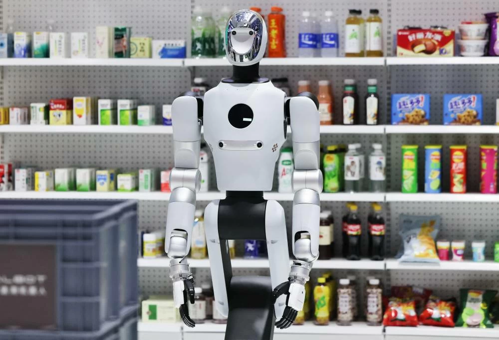 A Galbot G1 robot displayed next to shelves with goods at the company's booth at the 2026 World Robot Conference, in Beijing, China, August 20, 2026. (Reuters)