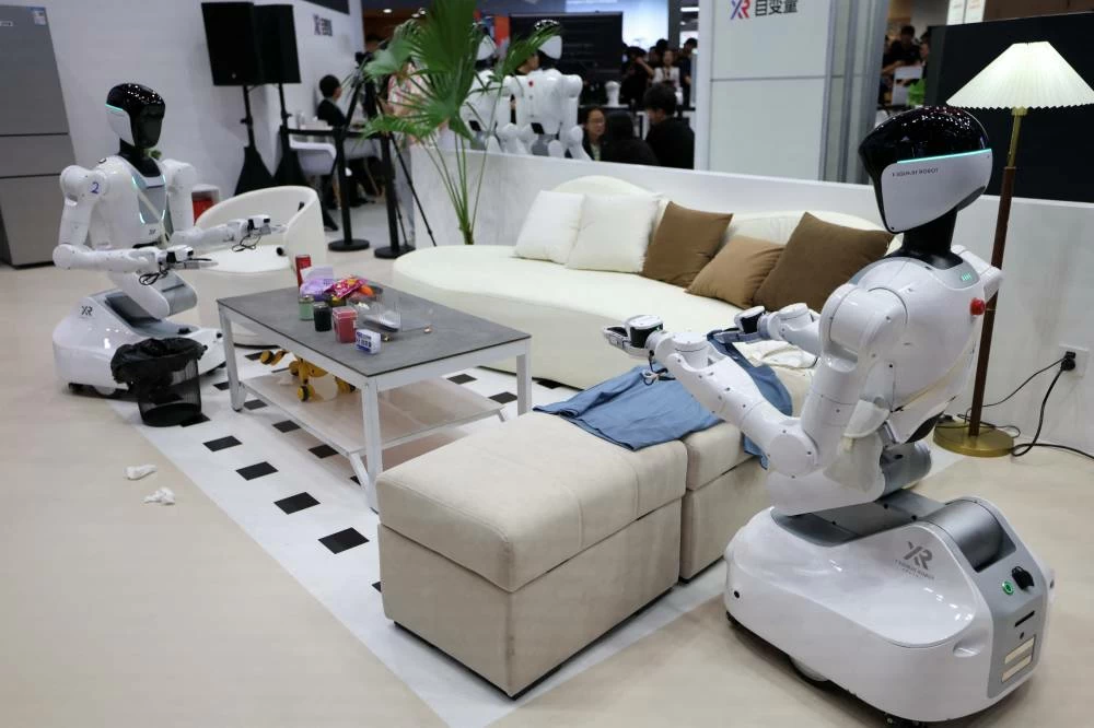 X Square humanoid robots demonstrate home work a the company's booth during the 2026 World Robot Conference, in Beijing, China August 19, 2026. (Reuters)