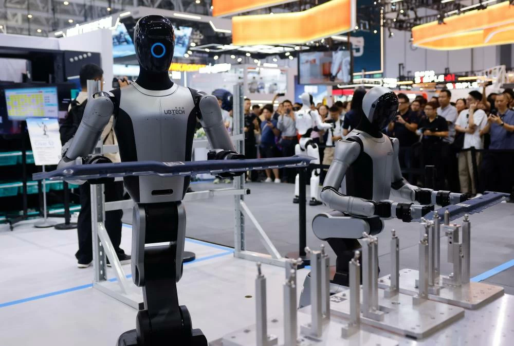 UBTech Cruzr S2 robots demonstrate their working capabilities at the company's booth at the 2026 World Robot Conference, in Beijing, China, August 20, 2026. (Reuters)