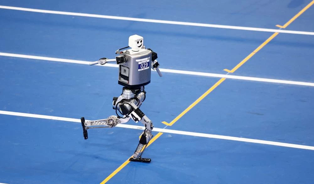 A humanoid robot by Noetix Robotics competes during a 100m large-sized group preliminary race, following the opening ceremony of the 2026 World Humanoid Robot Games. (Reuters)