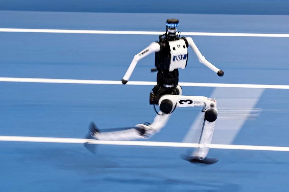 A Tiangong humanoid robot competes during a 100m large-sized group preliminary race, following the opening ceremony of the 2026 World Humanoid Robot Games. (Reuters)