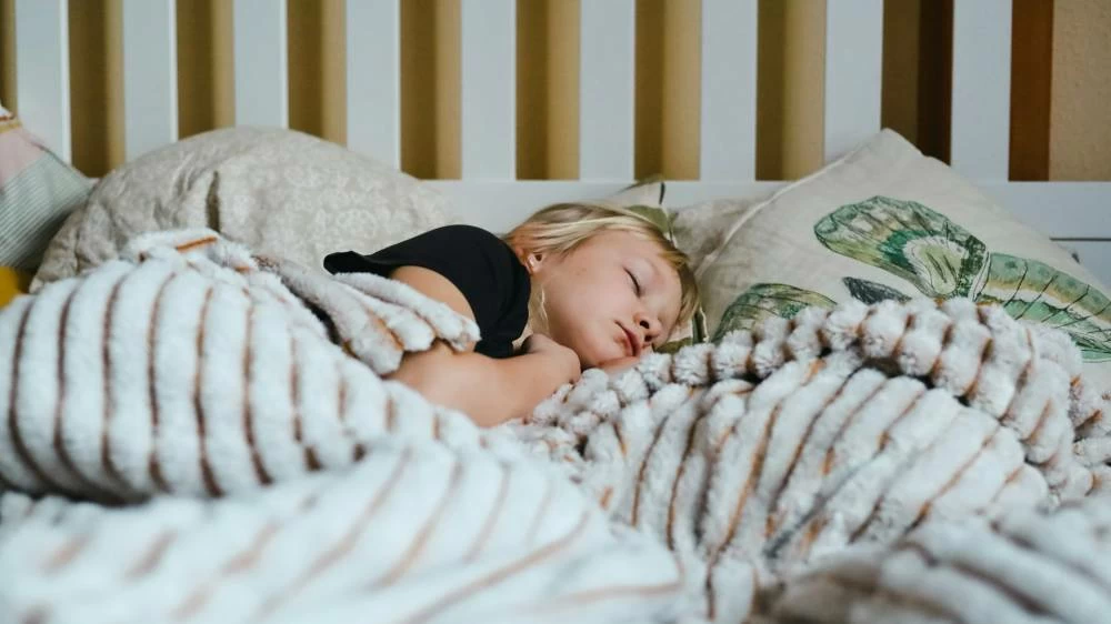 The amount of sleep kids need changes as they age. Preschoolers should get up to 13 hours of sleep. Tweens need between nine and 12 hours. Teenagers do best with eight to 10 hours of shut-eye. (Photo by Richard Stachmann on Unsplash)