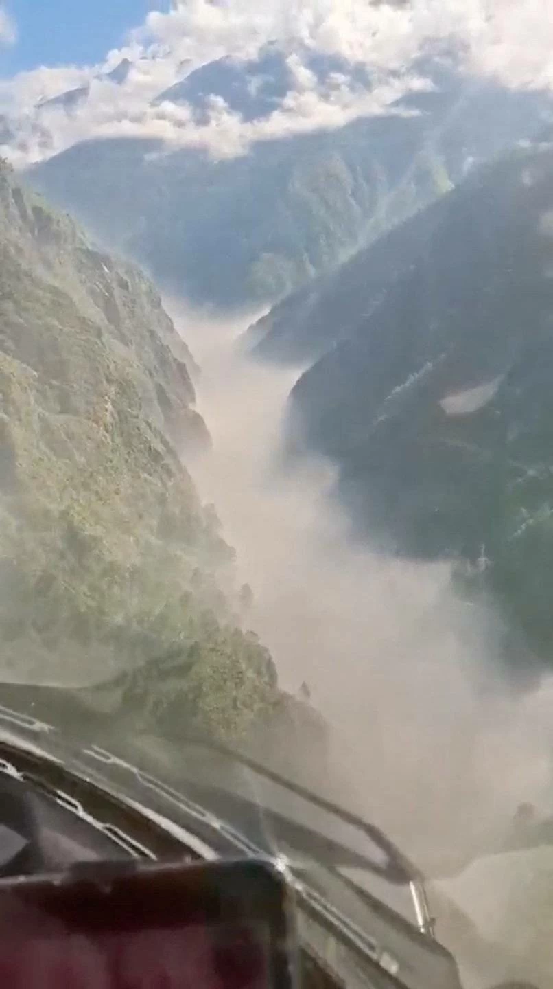 Helicopter footage shows flash flooding in the valleys in Rasuwa, Nepal, August 26, 2026, in this screengab taken from a handout video.    Altitude Air/Handout via REUTERS 