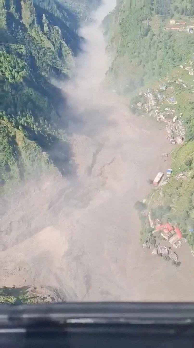 Helicopter footage shows flash flooding in the valleys in Rasuwa, Nepal, August 26, 2026, in this screengab taken from a handout video.    Altitude Air/Handout via REUTERS 