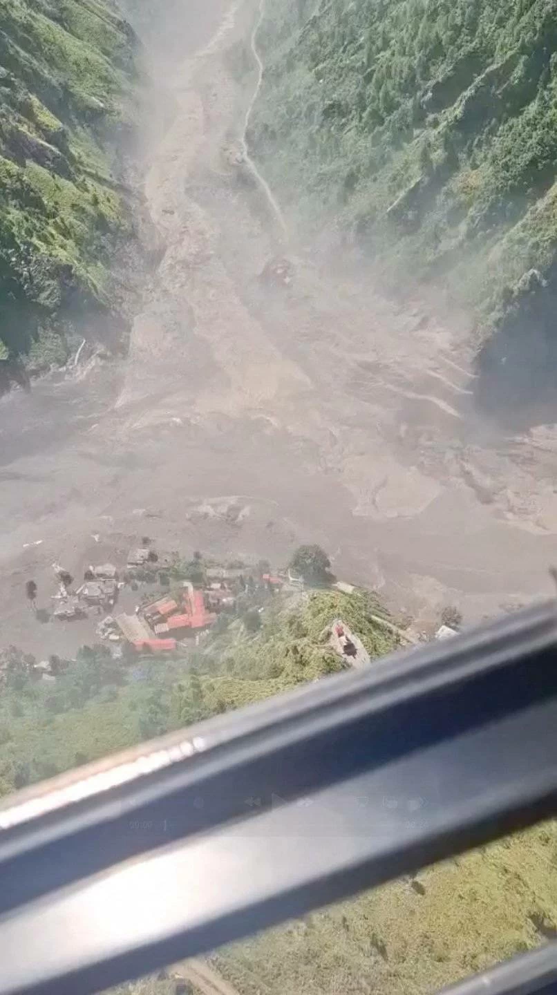 Helicopter footage shows flash flooding in the valleys in Rasuwa, Nepal, August 26, 2026, in this screengab taken from a handout video.    Altitude Air/Handout via REUTERS