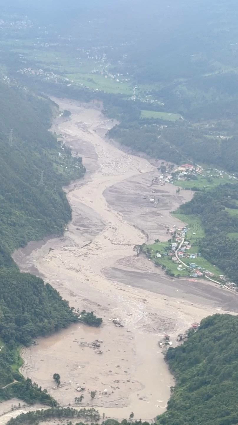 A muddy area viewed from a helicopter, in the aftermath of flash floods, in Rasuwa district, Nepal August 26, 2026 in this still image obtained from social media video. Pradip Pandit/Alpine Kailash Trek Pvt Ltd/via REUTERS