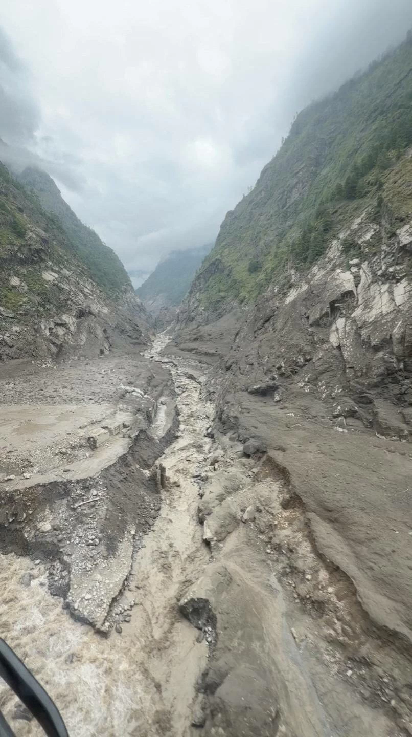 A muddy area viewed from a helicopter, in the aftermath of flash floods, in Rasuwa district, Nepal August 26, 2026 in this still image obtained from social media video. Pradip Pandit/Alpine Kailash Trek Pvt Ltd/via REUTERS 