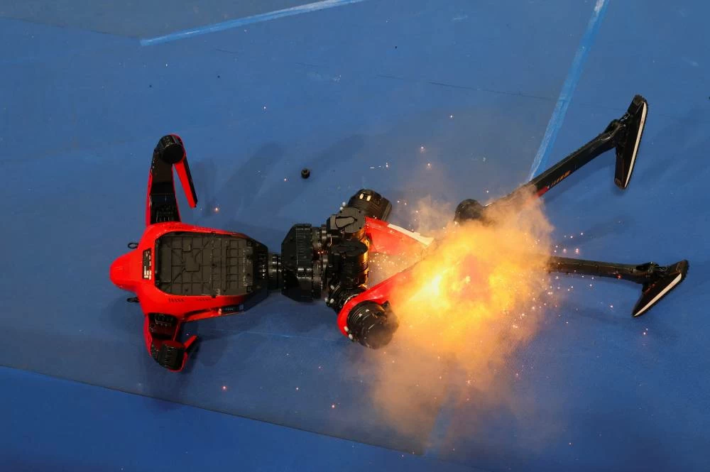 An Honor’s Lightning humanoid robot caught fire following the 100m large-size group final race, at the 2026 World Humanoid Robot Games at the National Speed Skating Oval in Beijing, China, August 26, 2026. REUTERS
