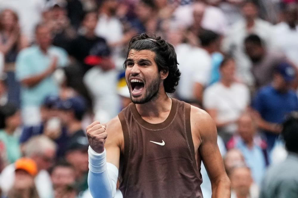 Carlos Alcaraz, of Spain, celebrates winning a match against Roman Safiullin, of Russia, during the first round of the U.S. Open tennis championships, Monday, Aug. 31, 2026, in New York. AP