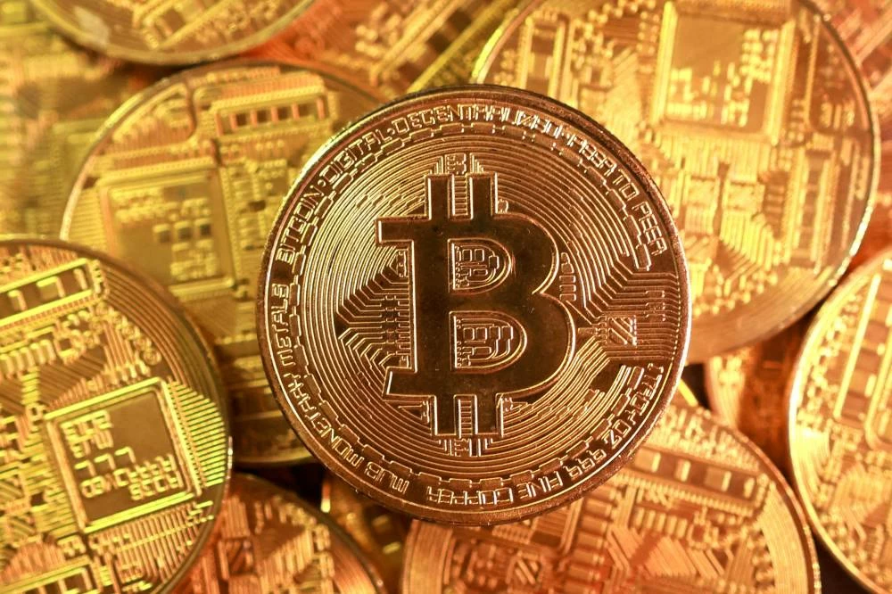 As gold trades near record highs and Bitcoin continues to mature as an institutional asset, Ivan Lee, Head of Trading at QCP, shares his perspective on institutional positioning, the evolution of Bitcoin as an investment asset, and how investors should assess both gold and digital assets over the long term. File picture used for illustrative purpose.