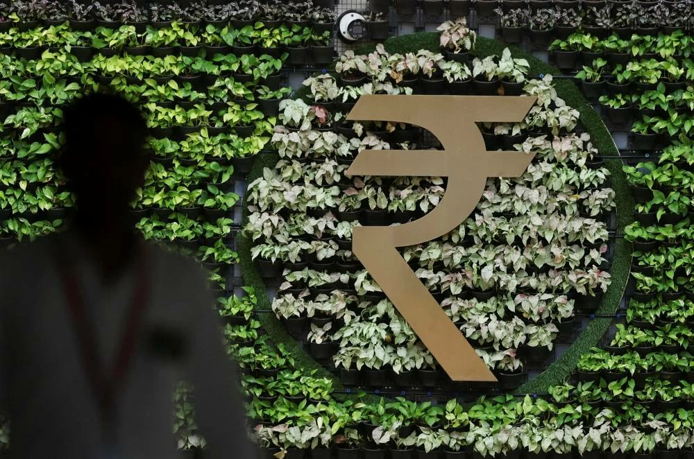 A man walks past an Indian Rupee symbol installation at the Reserve Bank of India (RBI) headquarters in Mumbai, India, August 5, 2026.(Reuters)