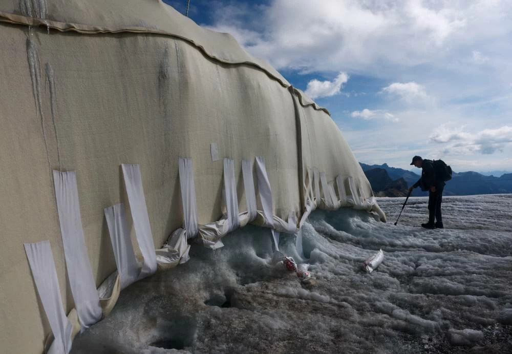 A sheep wool-covered snow protection test site is pictured during a press conference presenting the results of the "Keep It Wool" glacier protection experiment in Les Diablerets, Switzerland, September 2, 2026. (Reuters)