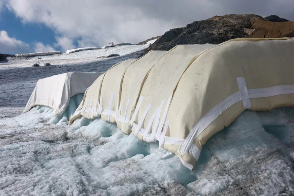 A sheep wool-covered snow protection test site is pictured during a press conference presenting the results of the "Keep It Wool" glacier protection experiment in Les Diablerets, Switzerland, September 2, 2026. (Reuters)