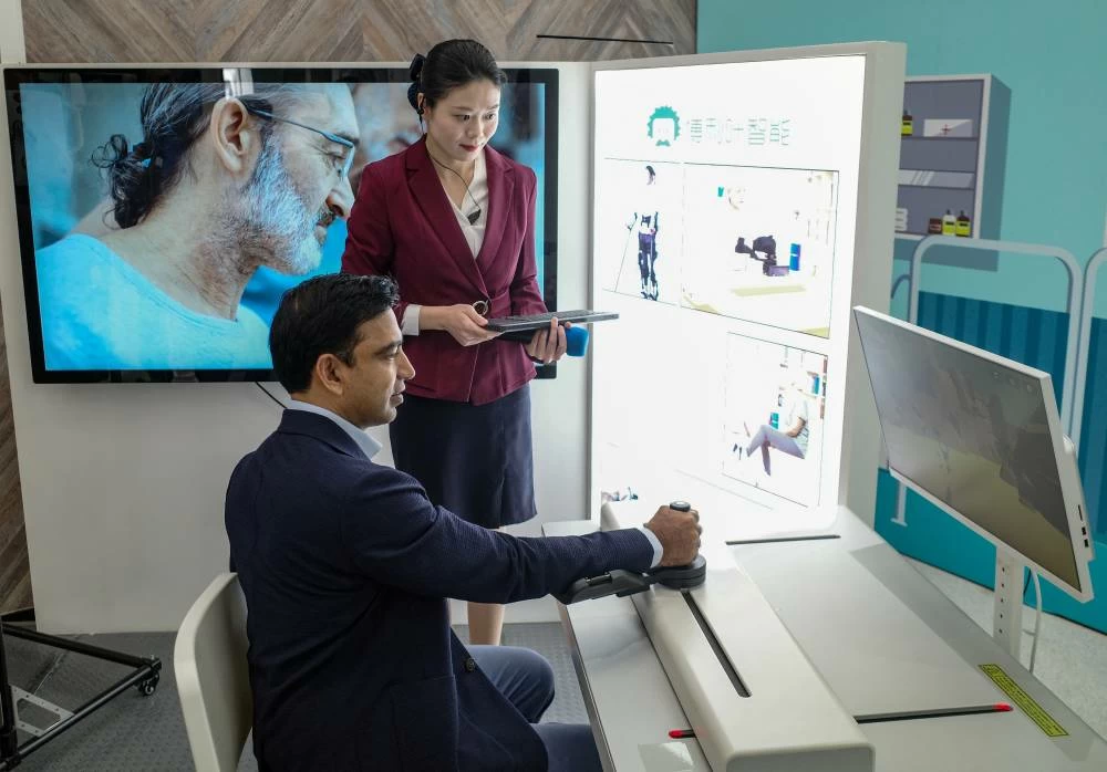 A man controls a medical robot at Zhangjiang Robot Valley Exhibition Hall during a tour for foreign investors in Shanghai, China, April 20, 2026. (Reuters)