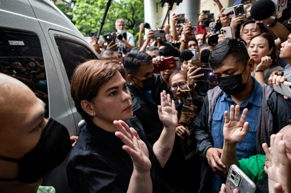Philippine Vice President Sara Duterte gestures outside Quezon City Regional Trial Court after posting bail, a day after a court ordered her arrest, in Quezon City, Philippines, September 5, 2026. (Reuters)