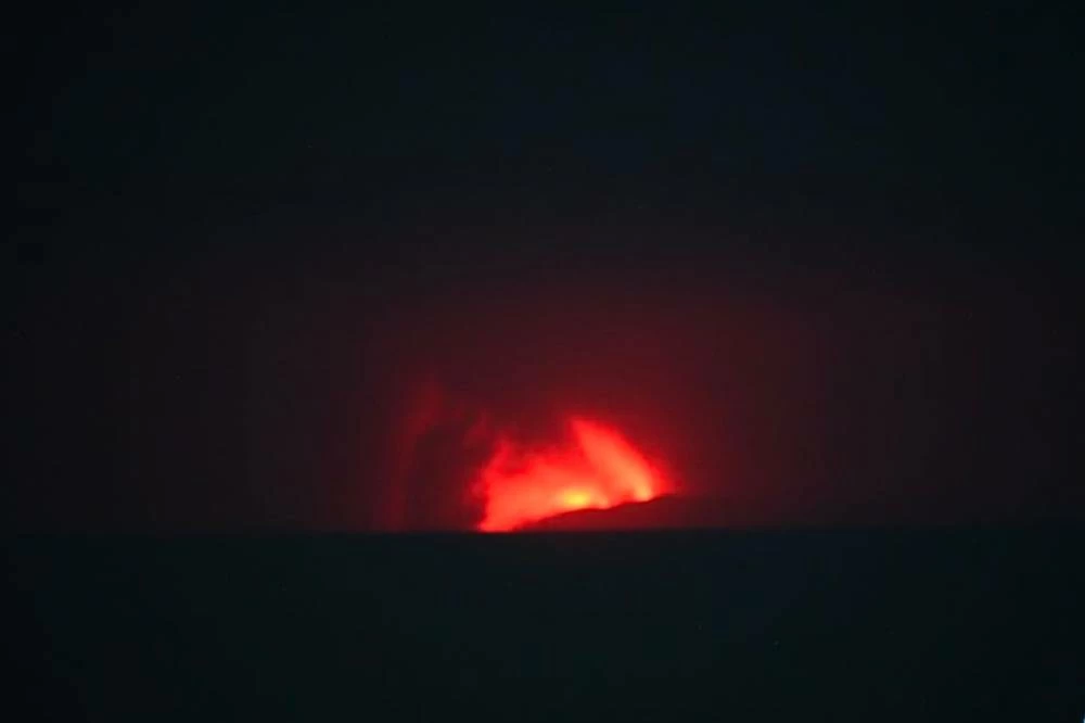 In this image released by Indonesia's Center for Volcanology and Geological Disaster Mitigation Agency (PVMBG), lava glows during the eruption of Mount Anak Krakatau in Sunda Strait, Indonesia. AP