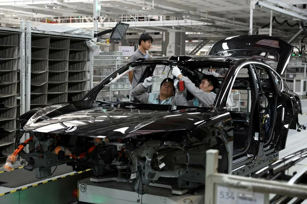File photo of employees work on the production line at a factory of Chinese electric vehicle (EV) maker Nio in Hefei, Anhui province, China. REUTERS