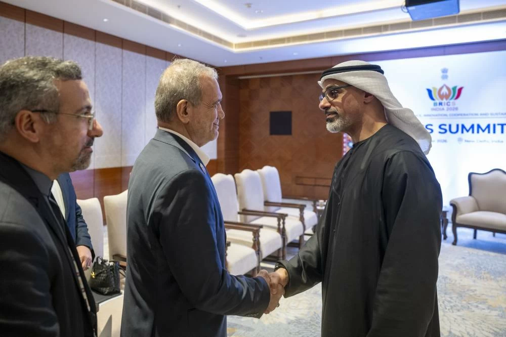 His Highness Sheikh Khaled bin Mohamed bin Zayed Al Nahyan, Crown Prince of Abu Dhabi, meets Dr Masoud Pezeshkian, President of the Islamic Republic of Iran, during the 18th BRICS Summit in New Delhi, India. (WAM)