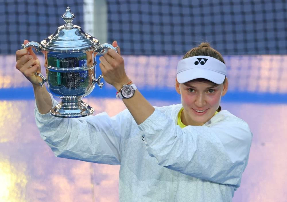 Elena Rybakina celebrates with the trophy after winning her women's singles final match against Belarus' Aryna Sabalenka REUTERS