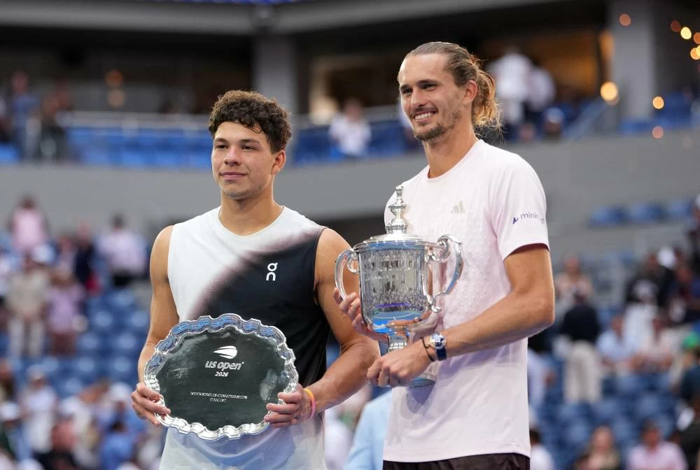 Germany's Alexander Zverev and Ben Shelton of the U.S. pose with their trophies after the men's singles final. Reuters