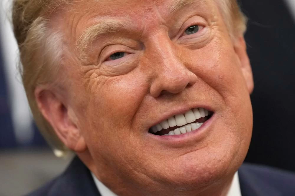 US President Donald Trump speaks to media in the Oval Office of the White House, Friday Sept. 18, 2026, in Washington. (AP)
