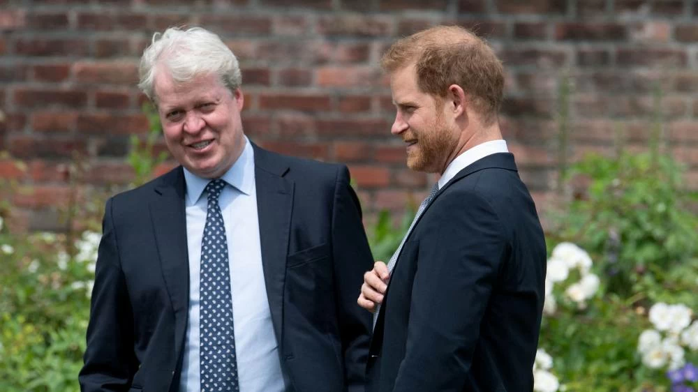 Britain's Prince Harry, Duke of Sussex, with his uncle Charles Spencer, 9th Earl Spencer, during the unveiling of a statue commissioned of his mother Diana, Princess of Wales, in the Sunken Garden at Kensington Palace, London, Britain July 1, 2021. (Reuters)