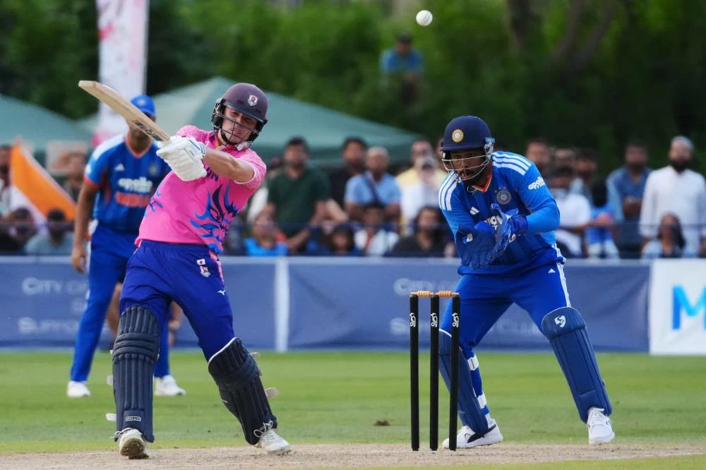 Japan's Kendel Kadowaki-Fleming, left, bats in front of India's Sanju Samson during the Suzuki Cup T20 cricket match in Sano, Japan, Tuesday, Sept. 22, 2026, marking 75 years of diplomatic relations between the two countries. (AP)