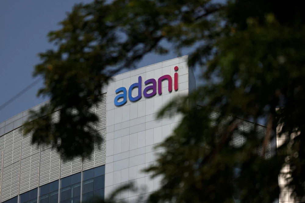 The logo of the Adani Group is seen on the facade of its Corporate House on the outskirts of Ahmedabad, India. (Reuters)