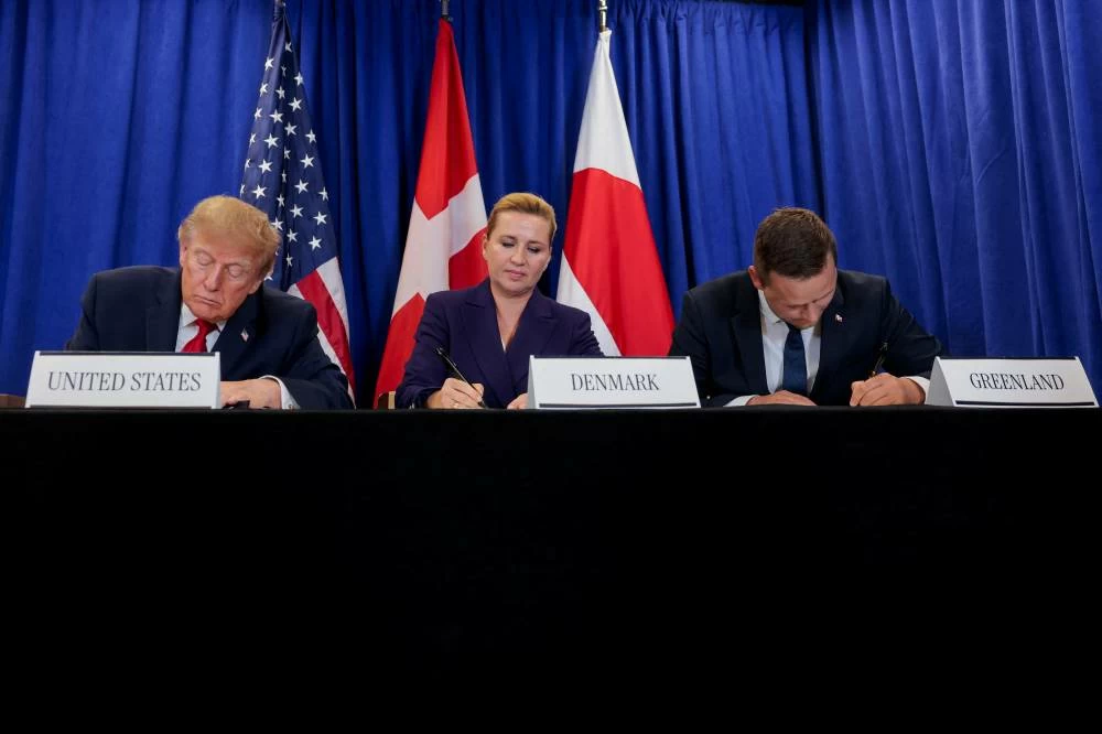 US President Donald Trump, Danish Prime Minister Mette Frederiksen and Greenland Prime Minister Jens-Frederik Nielsen attend  a trilateral signing event regarding a deal on Greenland's security, during the 81st United Nations General Assembly (UNGA), in New York City, US, September 22, 2026. REUTERS/Kylie Cooper