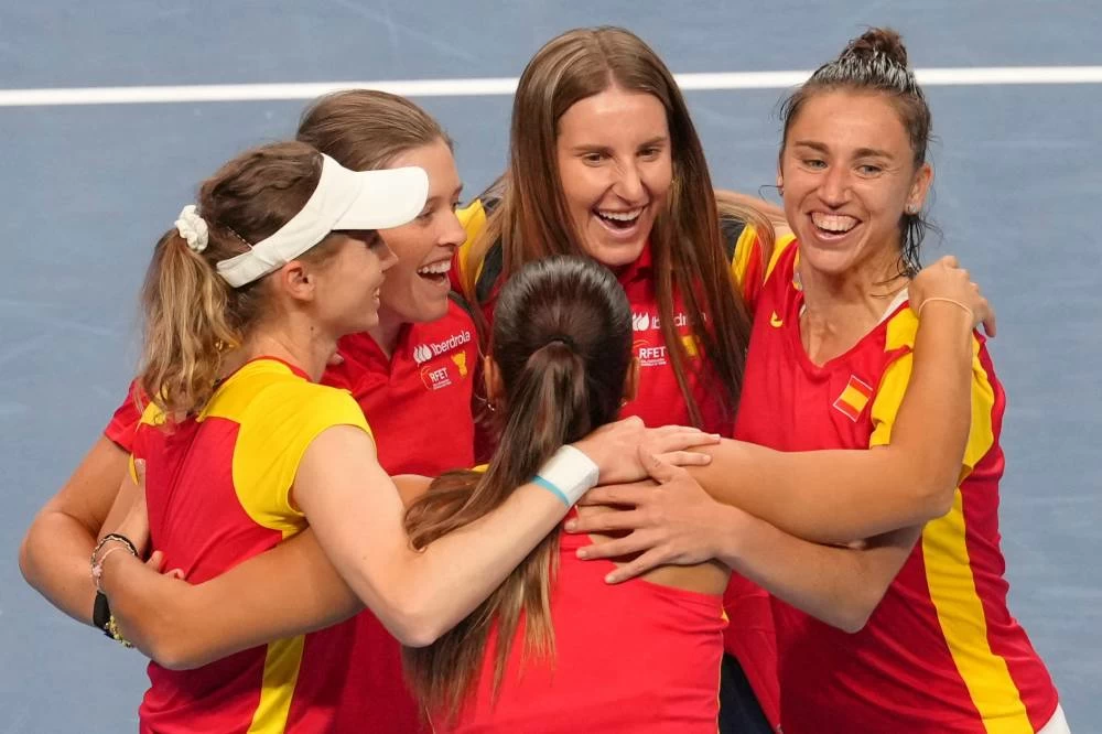 Spain's team members celebrate after defeating Kazakhstan in a quarterfinal match for the Billie Jean King Cup held in Shenzhen in southern China's Guangdong province, Wednesday, Sept. 23, 2026. (AP)