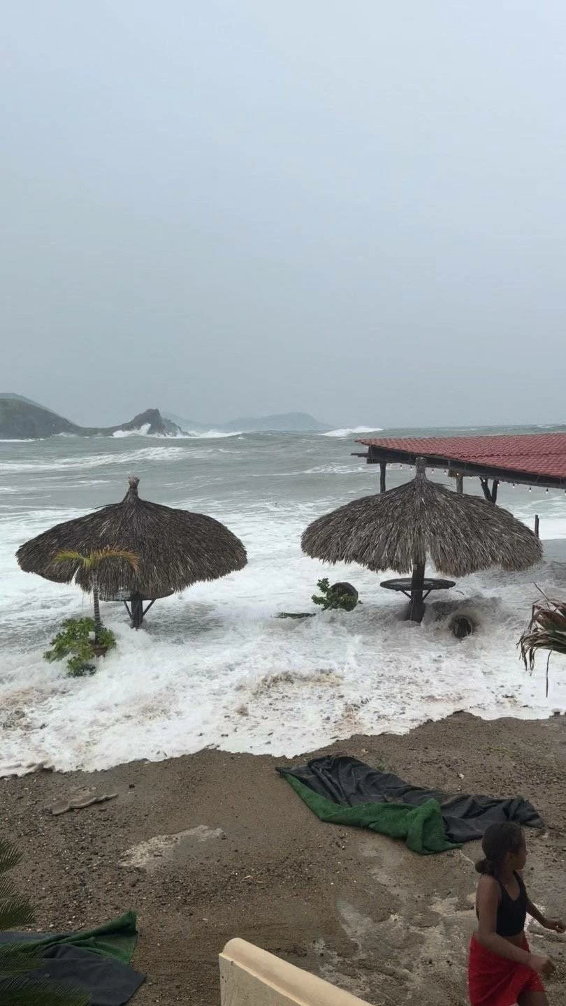 Waves from the storm surge caused by the proximity of Hurricane Polo flow around beach pavilions in Puerto Vicente Guerrero, Mexico, September 23, 2026, in this still image obtained from social media video.  Reuters