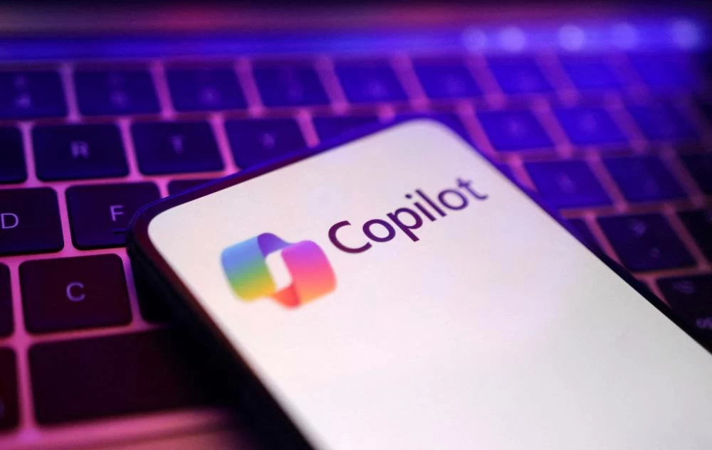 Microsoft is racing to expand Copilot beyond its chat-based roots to boost adoption as it competes with AI chatbots such as ChatGPT and Claude. (Reuters)