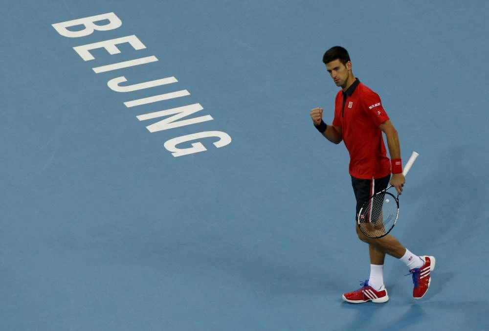 File photo: Novak Djokovic reacts after wining a point against John Isner of U.S. during their men's singles match at the China Open tennis tournament in Beijing, China, October 9, 2015. (Reuters)