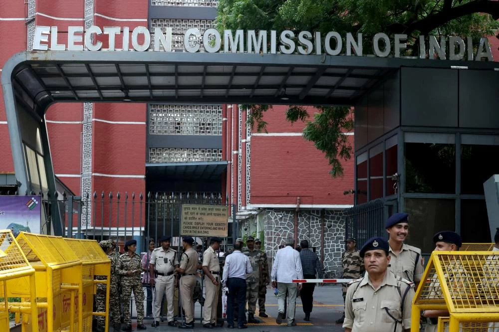 FILE PHOTO: Members of security forces stand guard at the entrance of Election Commission of India headquarters on the day of a protest by the supporters of India’s main opposition Congress party demanding the resignation of Chief Election Commissioner Gyanesh Kumar, in New Delhi. (Reuters)