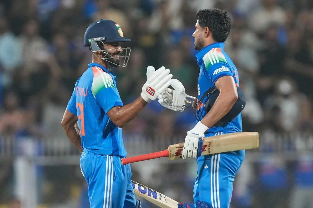 India's captain Shubman Gill, right, celebrates scoring a double century with batting partner Ruturaj Gaikwad during the second one-day international cricket match between India and West Indies in Guwahati, India, Wednesday, Sept. 30, 2026.(AP)